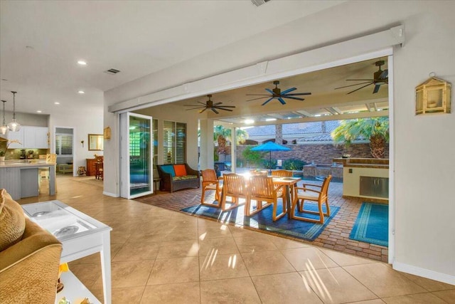 interior space featuring light tile patterned floors and a healthy amount of sunlight