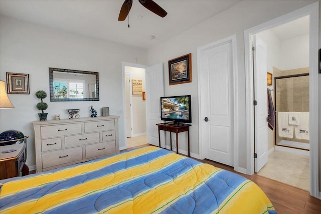 bedroom with ceiling fan and light hardwood / wood-style floors