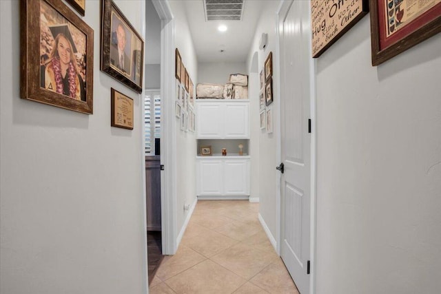 hall with light tile patterned flooring