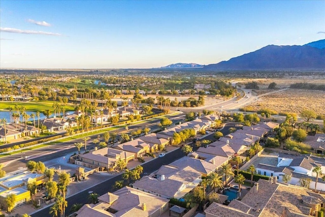 drone / aerial view with a water and mountain view