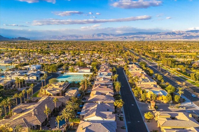 birds eye view of property with a mountain view