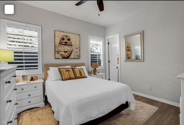 bedroom featuring ceiling fan and dark hardwood / wood-style floors