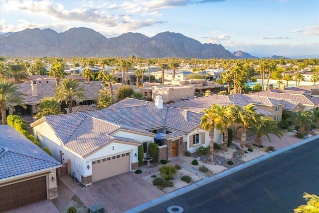 birds eye view of property with a mountain view