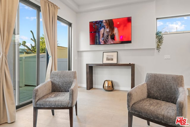 sitting room featuring hardwood / wood-style flooring