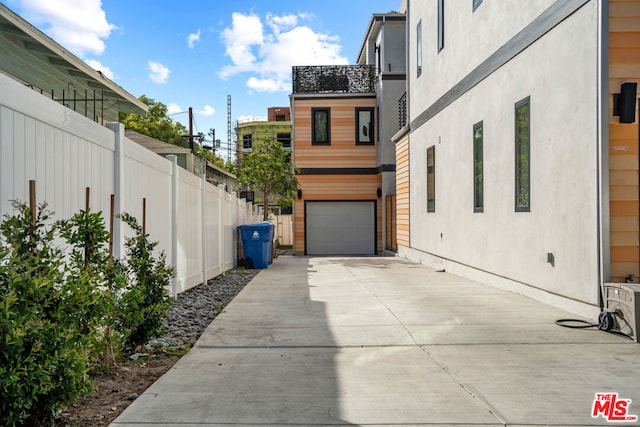 exterior space with a garage