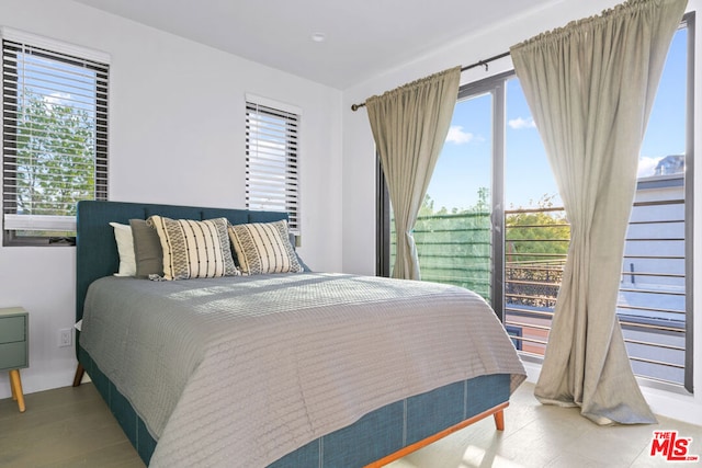 bedroom with hardwood / wood-style flooring