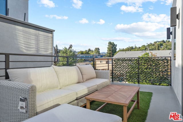 view of patio / terrace with a balcony