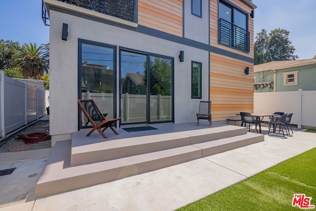 back of house with a patio area