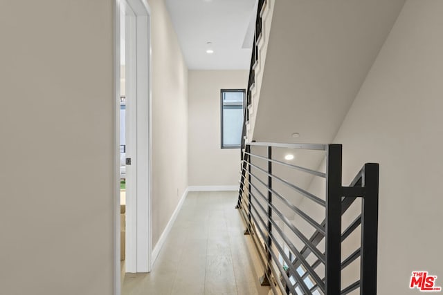 hallway with light wood-type flooring