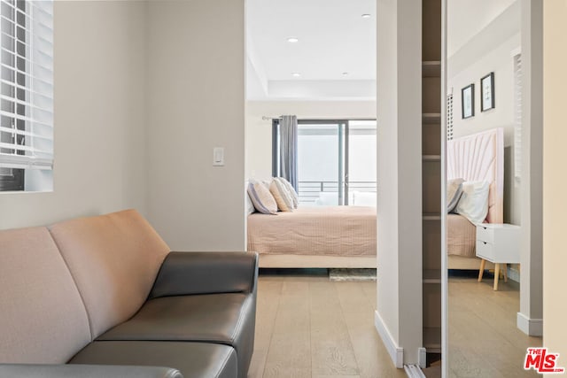 bedroom with light wood-type flooring