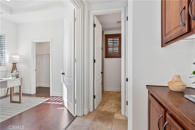 corridor with crown molding