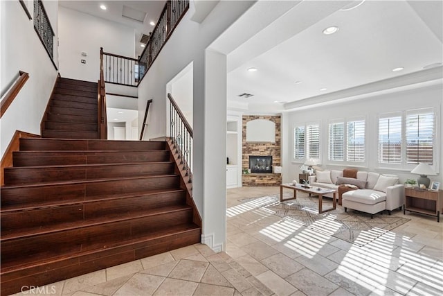 stairway with a fireplace