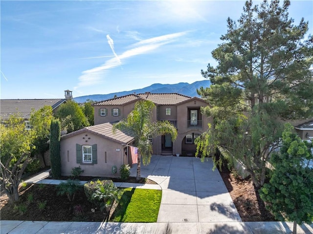 mediterranean / spanish-style home with a mountain view