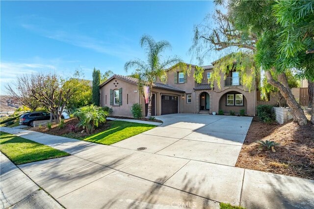 mediterranean / spanish house featuring a garage