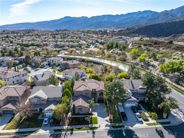 birds eye view of property with a mountain view