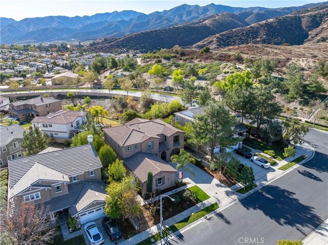 birds eye view of property with a mountain view