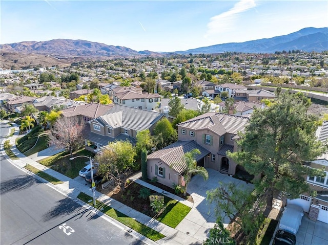 birds eye view of property with a mountain view