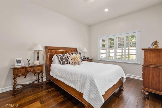 bedroom featuring dark hardwood / wood-style flooring