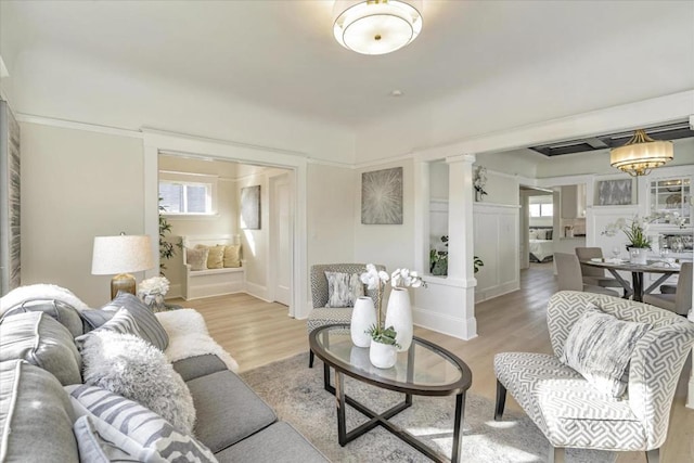 living room featuring light hardwood / wood-style floors and plenty of natural light