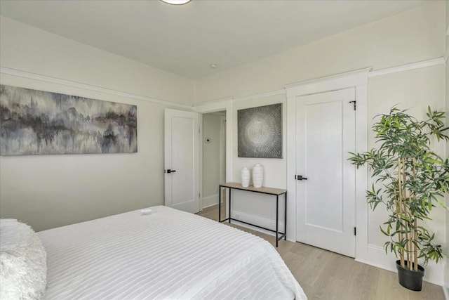 bedroom with light wood-type flooring