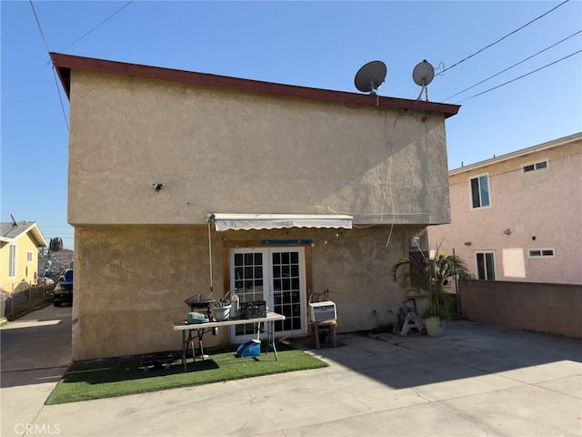 back of property with a patio area