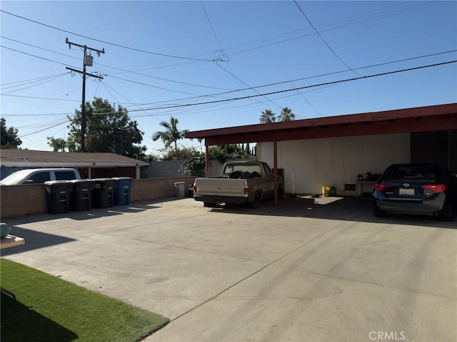 view of vehicle parking with a carport