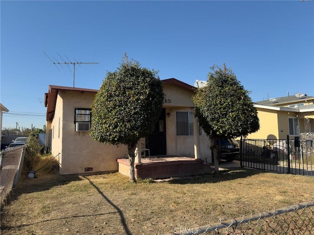 rear view of property with a yard