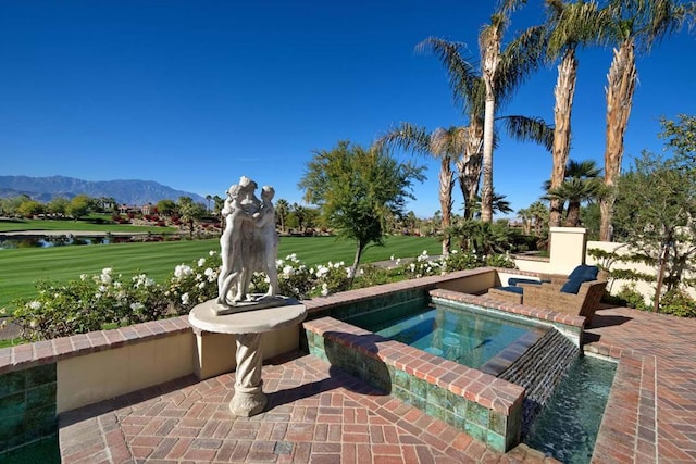 view of swimming pool featuring a mountain view and an in ground hot tub