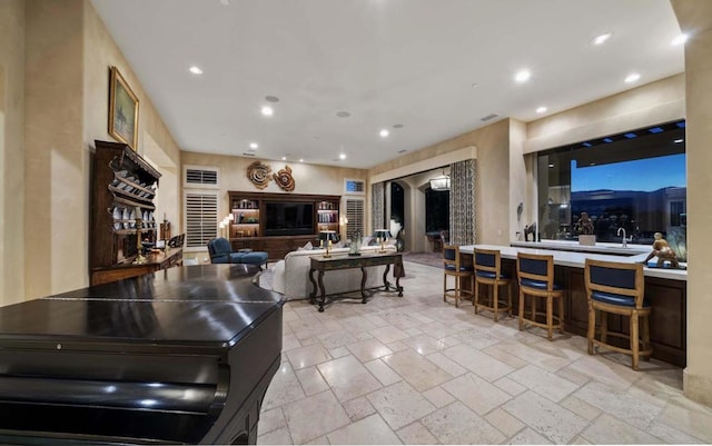 interior space with a kitchen breakfast bar and sink