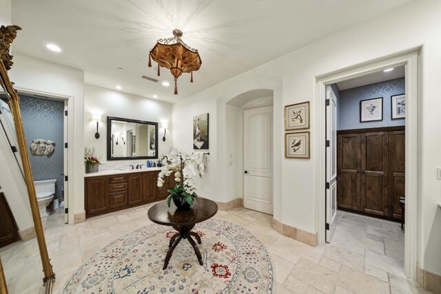 bathroom featuring toilet and vanity