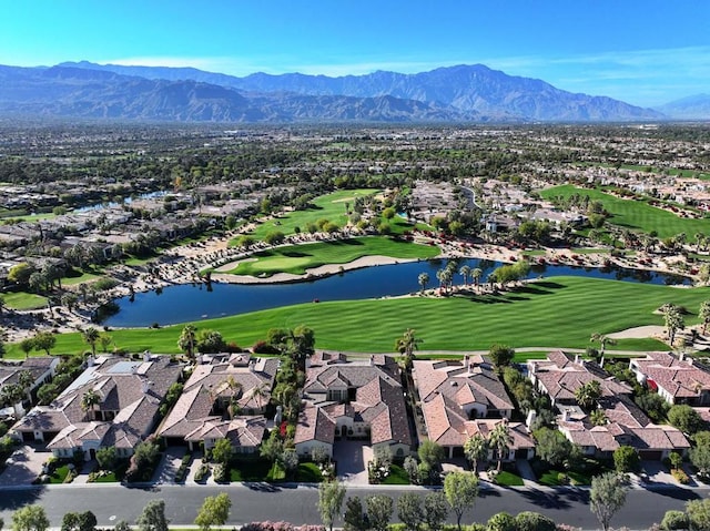 aerial view featuring a water and mountain view