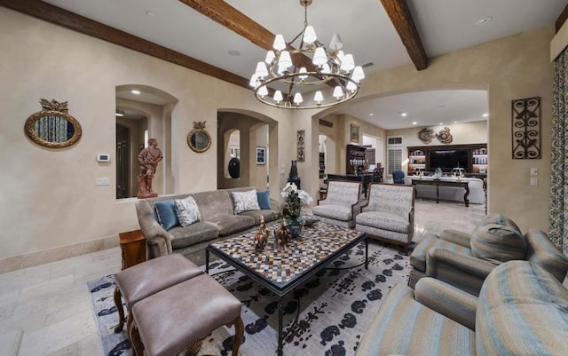 living room featuring beamed ceiling and a chandelier