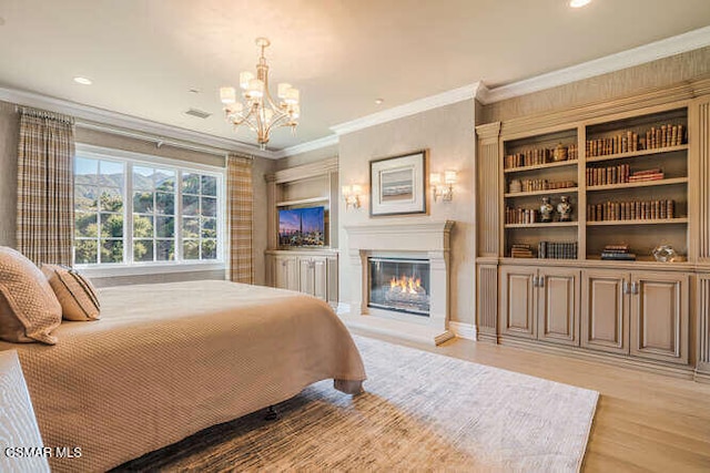 bedroom with a chandelier, light wood-type flooring, and ornamental molding