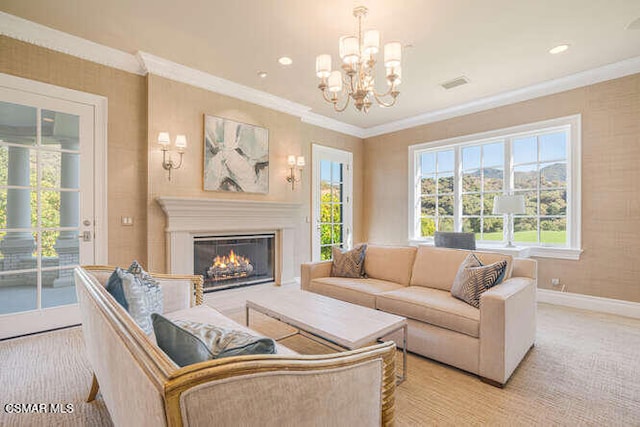 carpeted living room with plenty of natural light, crown molding, and a chandelier