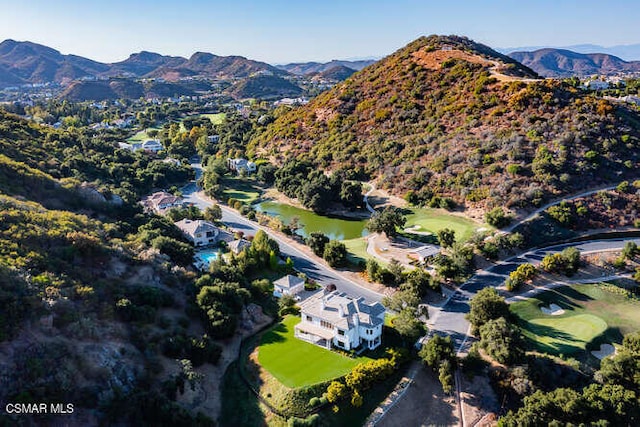 bird's eye view with a water and mountain view