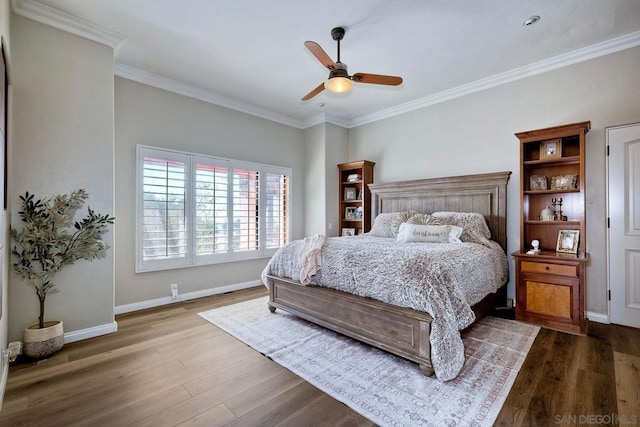 bedroom with ceiling fan, wood-type flooring, and crown molding