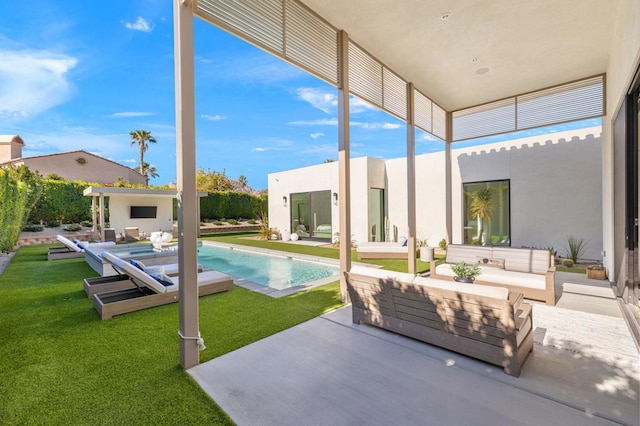 view of swimming pool featuring a lawn, an outdoor hangout area, and a patio