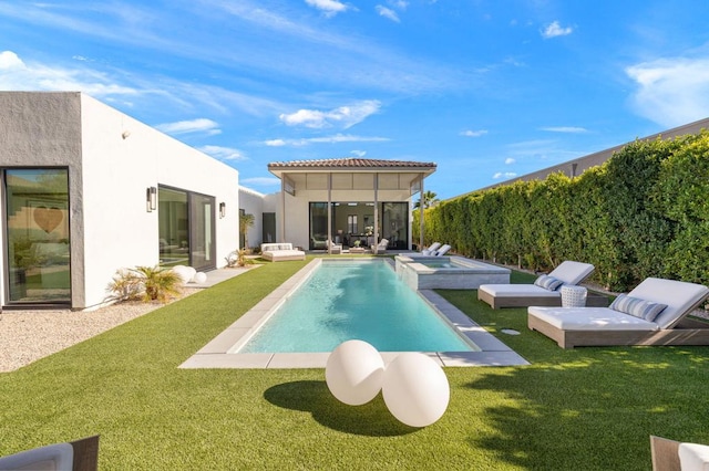 view of swimming pool with an in ground hot tub and a yard