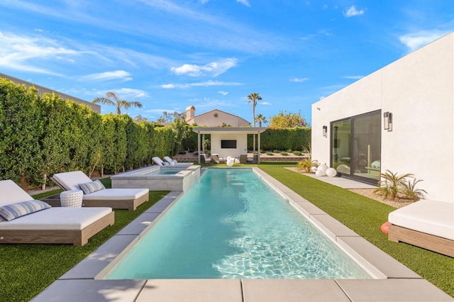 view of pool with an outdoor living space, an in ground hot tub, and a lawn