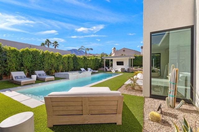 view of swimming pool with an in ground hot tub