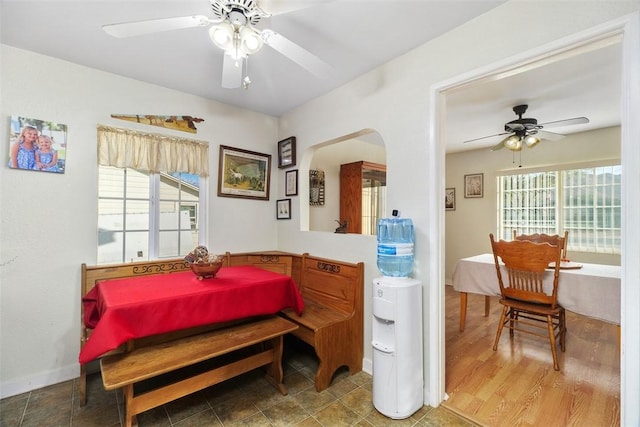 bedroom featuring ceiling fan and multiple windows