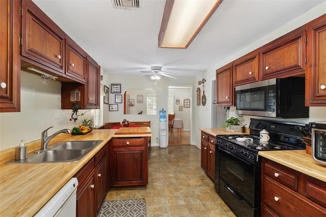 kitchen featuring ceiling fan, sink, dishwasher, and black gas range