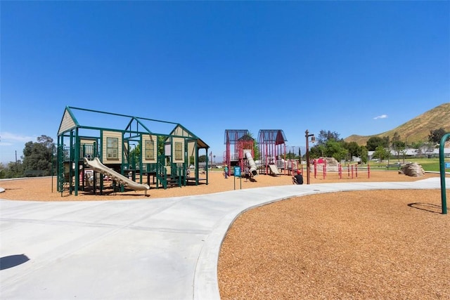 view of playground with a mountain view