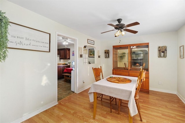 dining space with light wood-type flooring