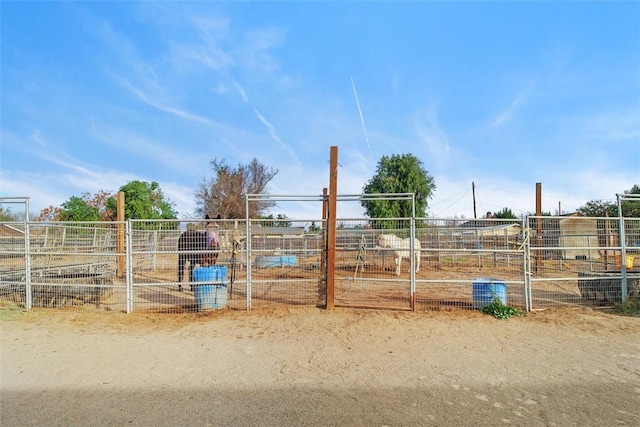 view of stable featuring a rural view