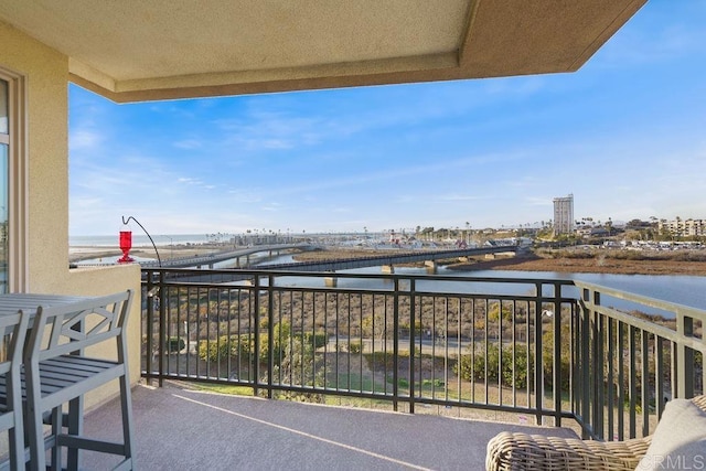 balcony featuring a water view