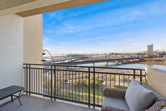 balcony featuring a water view