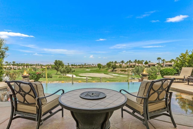 view of patio / terrace featuring a fire pit