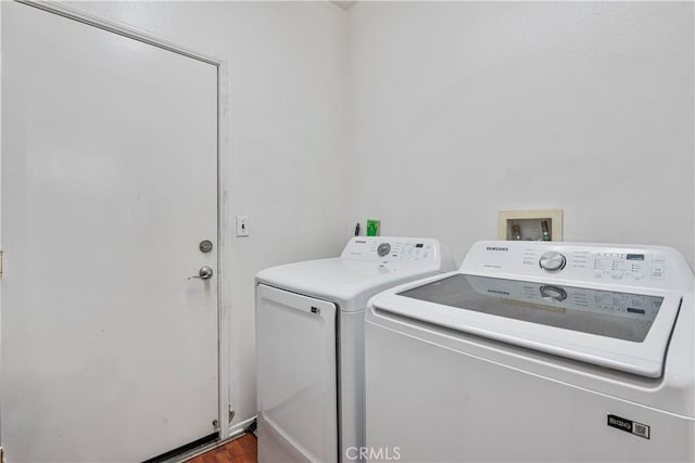 clothes washing area featuring washing machine and clothes dryer