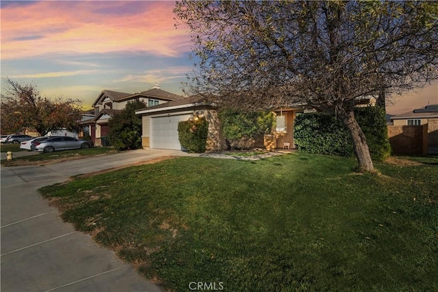 obstructed view of property featuring a garage and a lawn